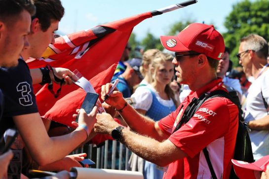 Sebastian Vettel (GER) Ferrari signs autographs for the fans.
29.06.2019. Formula 1 World Championship, Rd 9, Austrian Grand Prix, Spielberg, Austria, Qualifying Day.
- www.xpbimages.com, EMail: requests@xpbimages.com - copy of publication required for printed pictures. Every used picture is fee-liable. © Copyright: Moy / XPB Images