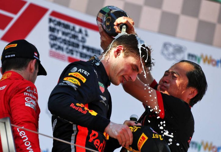 Race winner Max Verstappen (NLD) Red Bull Racing celebrates on the podium with Toyoharu Tanabe (JPN) Honda Racing F1 Technical Director.