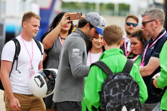 Carlos Sainz Jr (ESP) McLaren signs autographs for the fans.
11.07.2019. Formula 1 World Championship, Rd 10, British Grand Prix, Silverstone, England, Preparation Day.
- www.xpbimages.com, EMail: requests@xpbimages.com - copy of publication required for printed pictures. Every used picture is fee-liable. © Copyright: Moy / XPB Images