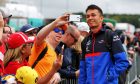 Alexander Albon (THA) Scuderia Toro Rosso with fans.