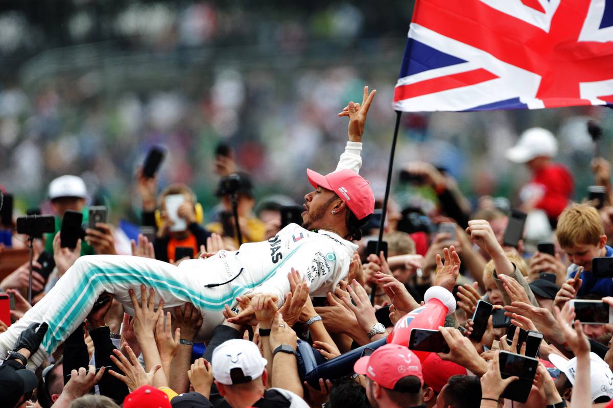 Race winner Lewis Hamilton (GBR) Mercedes AMG F1 celebrates with fans after the podium.