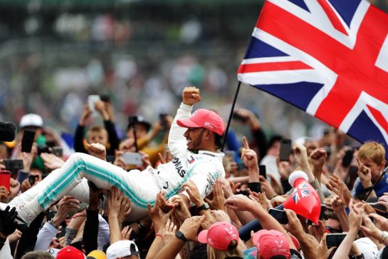 Race winner Lewis Hamilton (GBR) Mercedes AMG F1 celebrates with fans after the podium.
14.07.2019. Formula 1 World Championship, Rd 10, British Grand Prix, Silverstone, England, Race Day.
 - www.xpbimages.com, EMail: requests@xpbimages.com - copy of publication required for printed pictures. Every used picture is fee-liable. © Copyright: Bearne / XPB Images