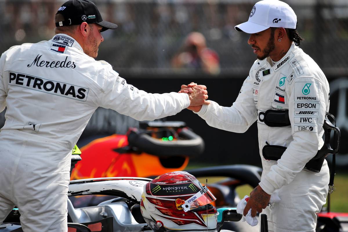 Lewis Hamilton (GBR) Mercedes AMG F1 celebrates his pole position in qualifying parc ferme with third placed team mate Valtteri Bottas (FIN) Mercedes AMG F1.