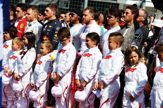 Grid kids with the drivers as the grid observes the national anthem.
04.08.2019. Formula 1 World Championship, Rd 12, Hungarian Grand Prix, Budapest, Hungary, Race Day.
- www.xpbimages.com, EMail: requests@xpbimages.com - copy of publication required for printed pictures. Every used picture is fee-liable. © Copyright: Moy / XPB Images