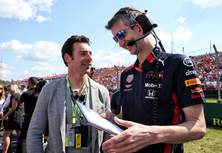 Simon Pagenaud (FRA) Team Penske IndyCar Driver with Red Bull Racing on the grid.