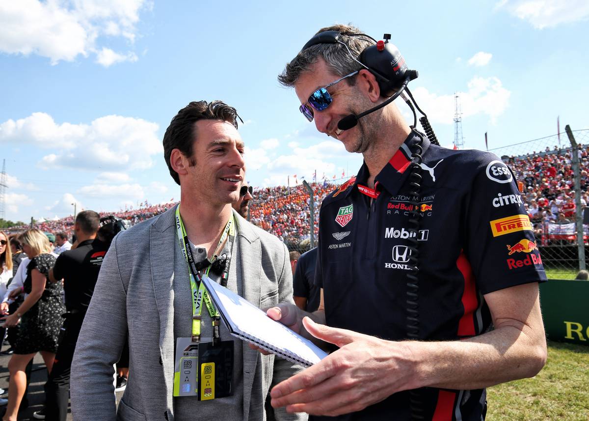 Simon Pagenaud (FRA) Team Penske IndyCar Driver with Red Bull Racing on the grid.