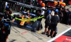 Lando Norris (GBR) McLaren MCL34 in the pits.