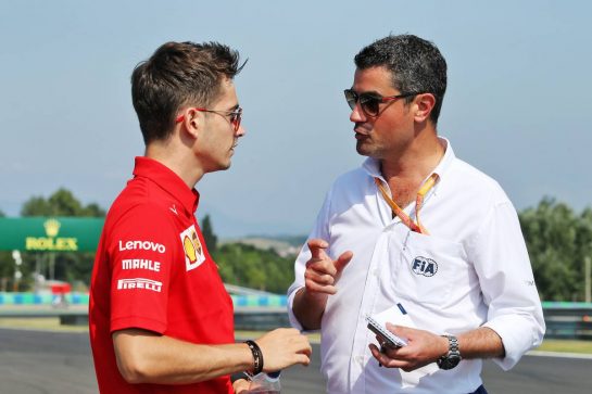 (L to R): Charles Leclerc (MON) Ferrari with Michael Masi (AUS) FIA Race Director.
01.08.2019. Formula 1 World Championship, Rd 12, Hungarian Grand Prix, Budapest, Hungary, Preparation Day.
- www.xpbimages.com, EMail: requests@xpbimages.com - copy of publication required for printed pictures. Every used picture is fee-liable. © Copyright: Moy / XPB Images