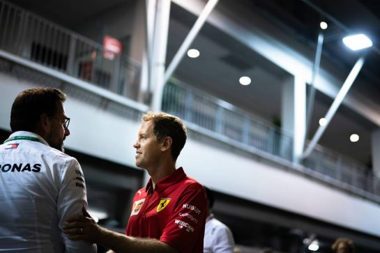 Sebastian Vettel (GER) Ferrari with Gwen Lagrue, Head of Mercedes AMG Driver Development.
19.09.2019. Formula 1 World Championship, Rd 15, Singapore Grand Prix, Marina Bay Street Circuit, Singapore, Preparation Day.
- www.xpbimages.com, EMail: requests@xpbimages.com - copy of publication required for printed pictures. Every used picture is fee-liable. © Copyright: Dungan / XPB Images