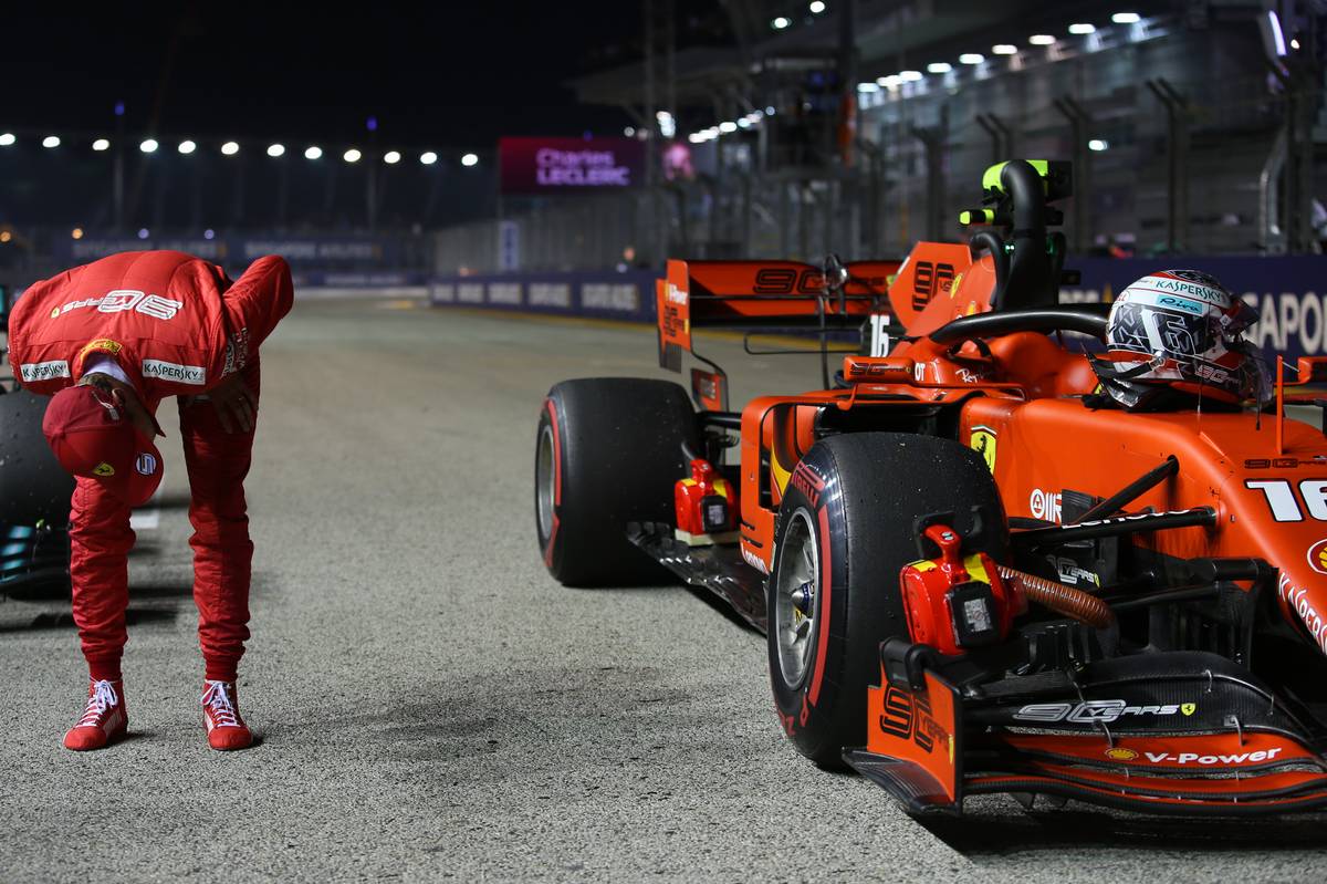 Sebastian Vettel (GER) Ferrari SF90 looking at Charles Leclerc (MON) Ferrari.