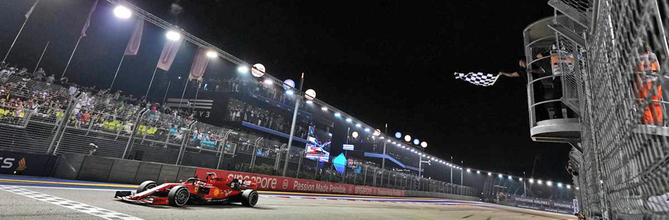 Race winner Sebastian Vettel (GER) Ferrari SF90 takes the chequered flag at the end of the race.