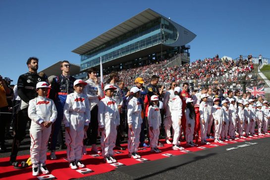 The drivers during the national anthem.13.10.2019. Formula 1 World Championship, Rd 17, Japanese Grand Prix, Suzuka, Japan, Race Day.- www.xpbimages.com, EMail: requests@xpbimages.com - copy of publication required for printed pictures. Every used picture is fee-liable. © Copyright: Batchelor / XPB Images