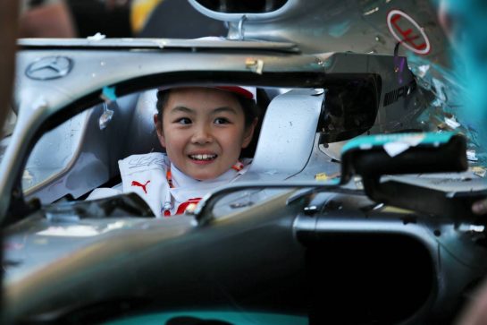 A grid kid gets to sit in the Mercedes AMG F1 W10.
13.10.2019. Formula 1 World Championship, Rd 17, Japanese Grand Prix, Suzuka, Japan, Sunday.
 - www.xpbimages.com, EMail: requests@xpbimages.com - copy of publication required for printed pictures. Every used picture is fee-liable. © Copyright: Filipe / XPB Images