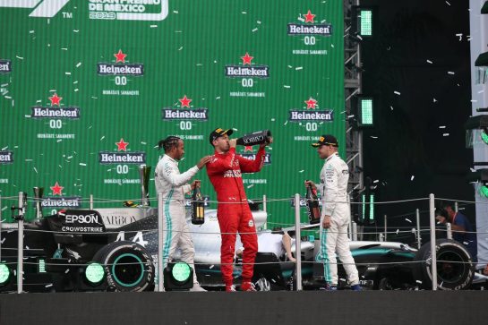 1st place Lewis Hamilton (GBR) Mercedes AMG F1 W10 with 2nd place Sebastian Vettel (GER) Ferrari SF90 and 3rd place Valtteri Bottas (FIN) Mercedes AMG F1 W10.27.10.2019. Formula 1 World Championship, Rd 18, Mexican Grand Prix, Mexico City, Mexico, Race Day.- www.xpbimages.com, EMail: requests@xpbimages.com © Copyright: Batchelor / XPB Images