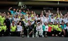 Race winner Lewis Hamilton (GBR) Mercedes AMG F1 and third placed Valtteri Bottas (FIN) Mercedes AMG F1 celebrate with the team.