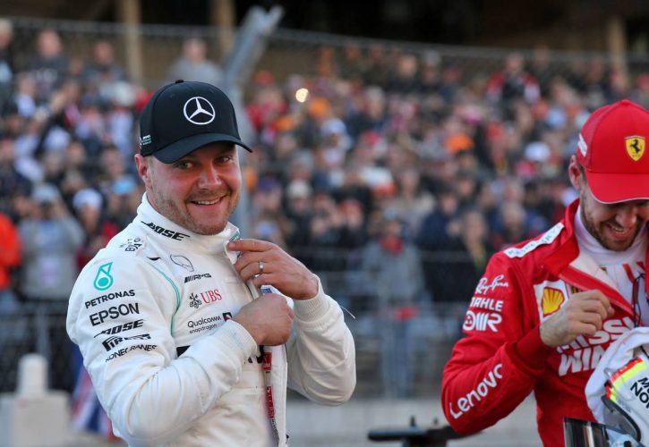 Valtteri Bottas (FIN) Mercedes AMG F1 celebrates his pole position in qualifying parc ferme with Sebastian Vettel (GER) Ferrari.
