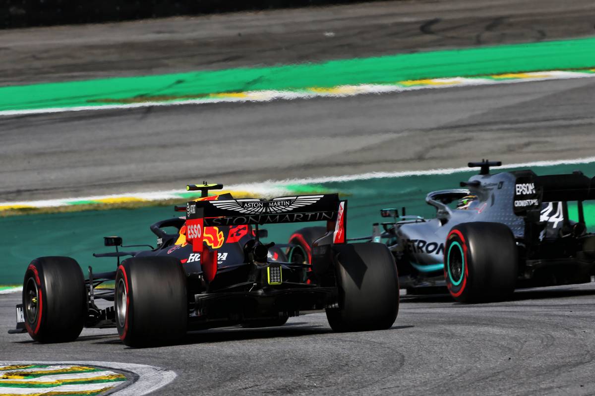 Alexander Albon (THA) Red Bull Racing RB15 and Lewis Hamilton (GBR) Mercedes AMG F1 W10 battle for position.