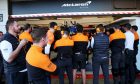 Human wall outside the McLaren pit garage.