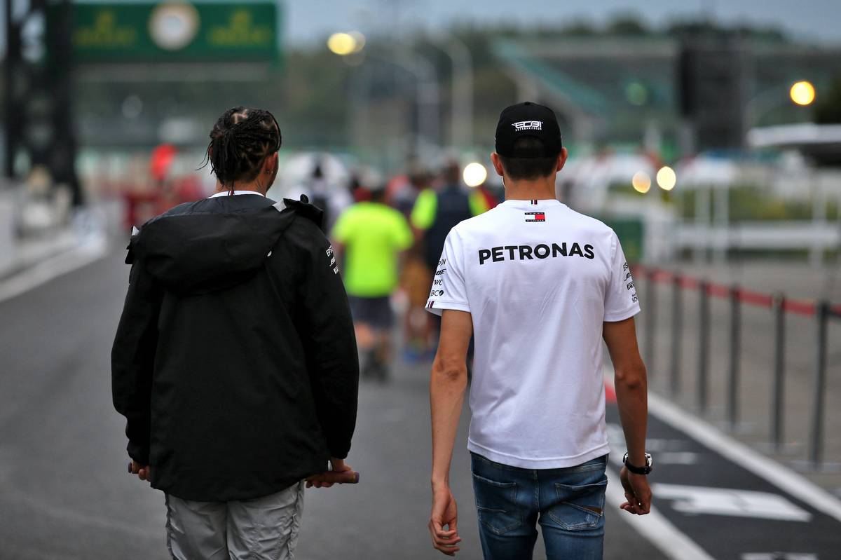 Lewis Hamilton (GBR) Mercedes AMG F1 with Esteban Ocon (FRA) Mercedes AMG F1 Reserve Driver.