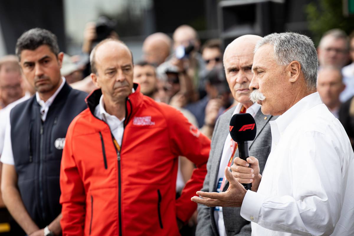 Chase Carey (USA) Formula One Group Chairman; Andrew Wesatcott (AUS) Australian Grand Prix Corporation Chief Executive Officer; and Michael Masi (AUS) FIA Race Director, at an outdoor press conference following the cancellation of the Australian Grand Prix.