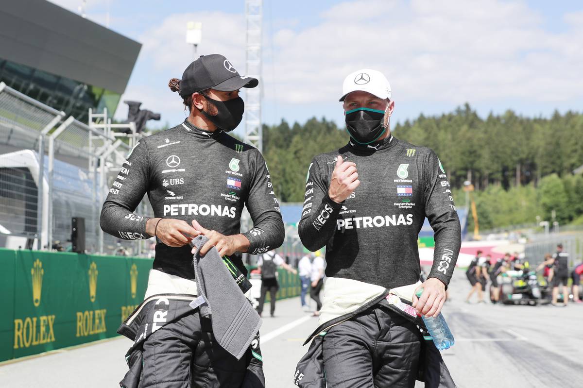 Lewis Hamilton (GBR) Mercedes AMG F1 with his team mate Valtteri Bottas (FIN) Mercedes AMG F1 in qualifying parc ferme.