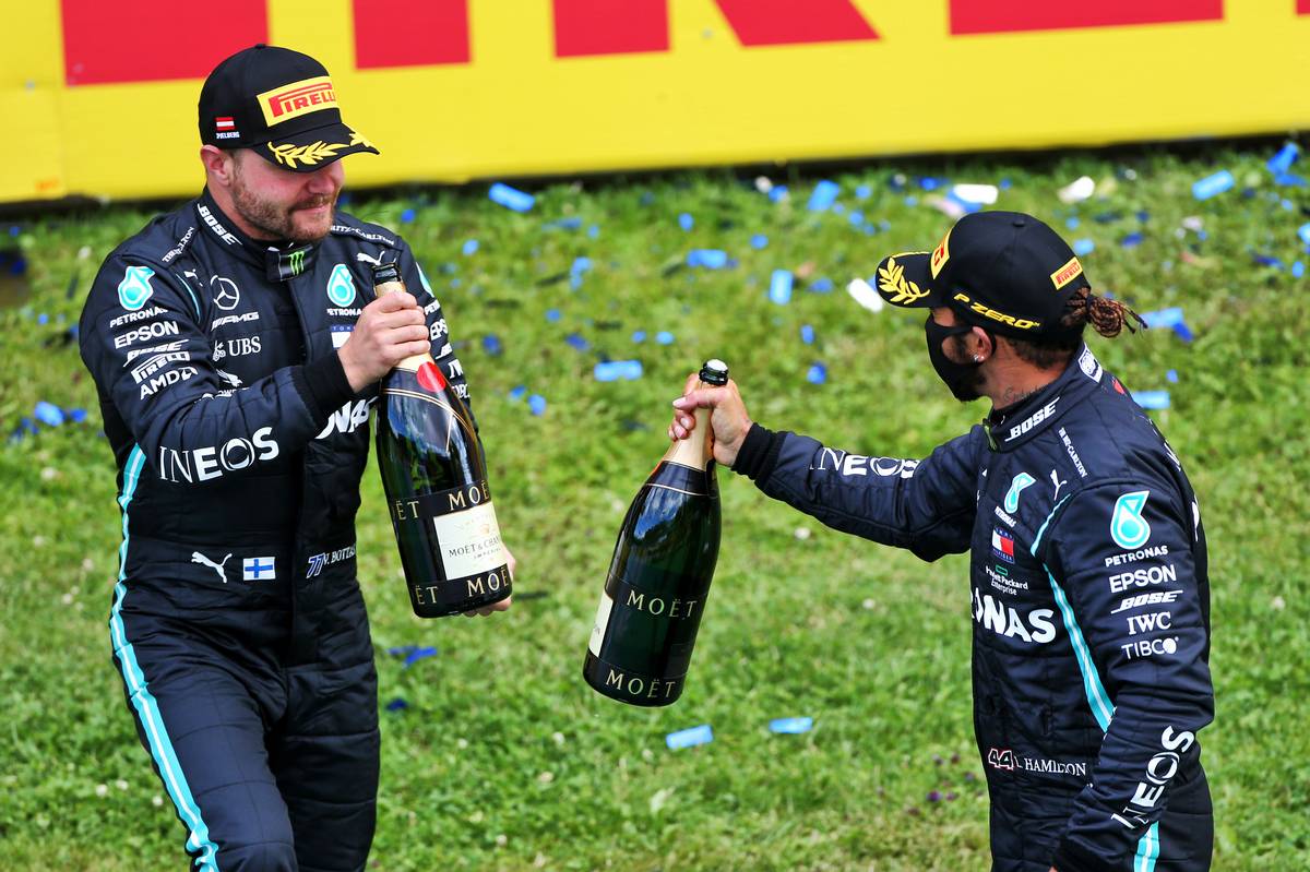 Valtteri Bottas (FIN) Mercedes AMG F1 celebrates his second position with race winner and team mate Lewis Hamilton (GBR) Mercedes AMG F1.