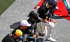 Lewis Hamilton (GBR) Mercedes AMG F1 takes a knee with team mate Valtteri Bottas (FIN) Mercedes AMG F1 on the grid.