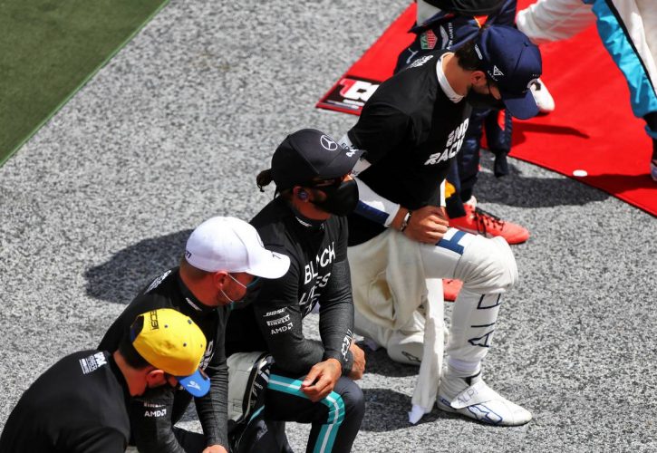 Lewis Hamilton (GBR) Mercedes AMG F1 takes a knee with team mate Valtteri Bottas (FIN) Mercedes AMG F1 on the grid.