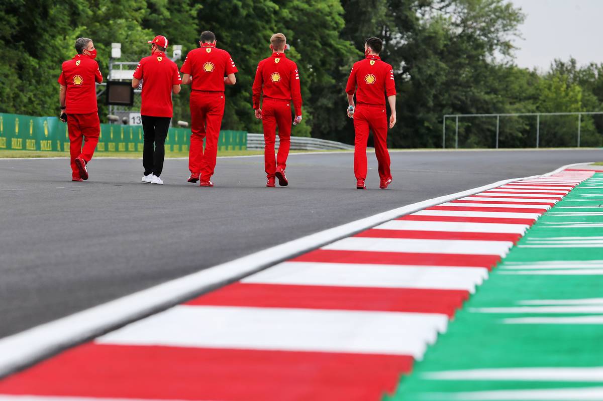Sebastian Vettel (GER) Ferrari walks the circuit with the team.
