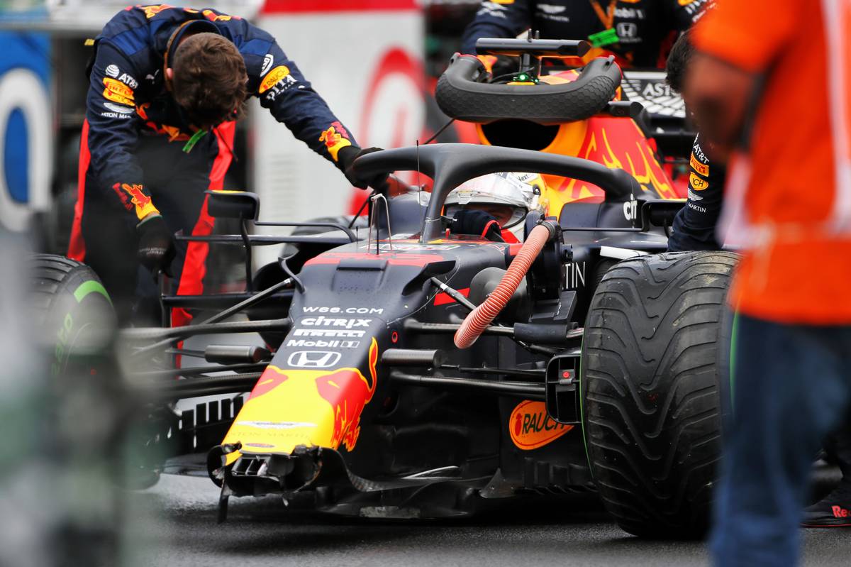 Max Verstappen (NLD) Red Bull Racing RB16 with a broken front wing on the grid.