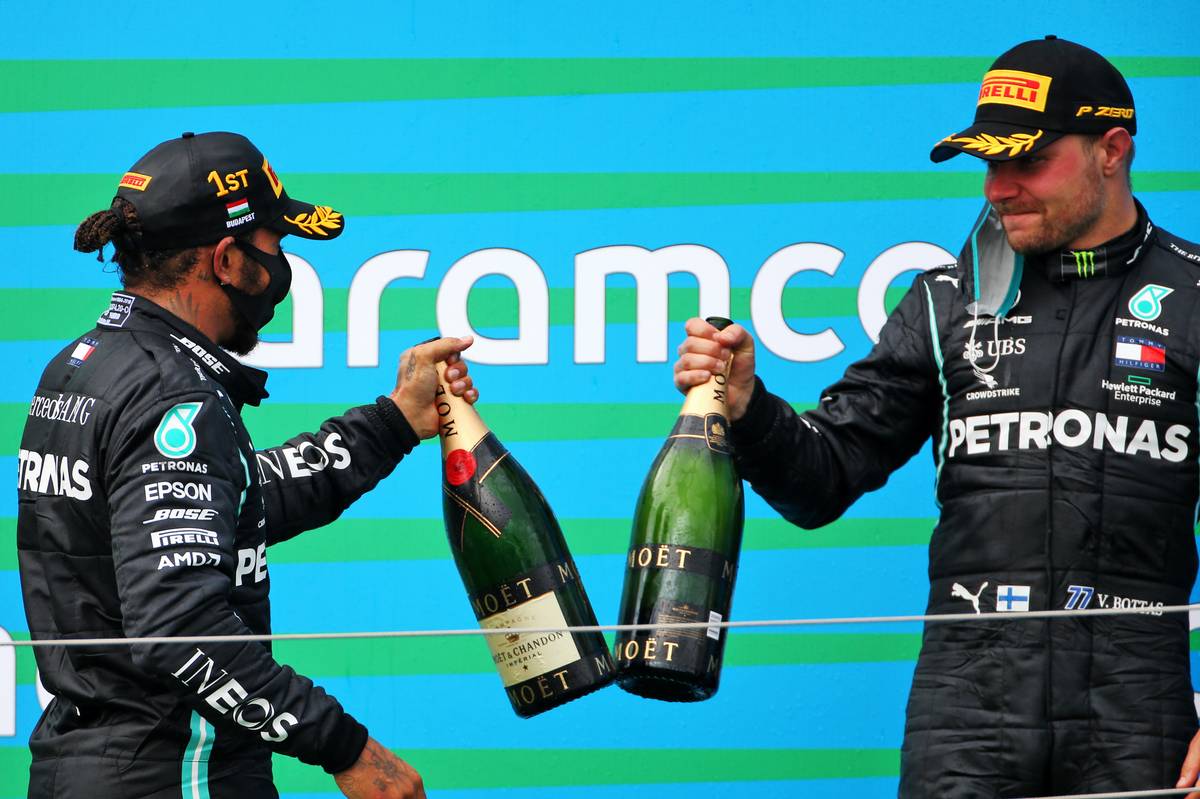 Race winner Lewis Hamilton (GBR) Mercedes AMG F1 with third placed team mate Valtteri Bottas (FIN) Mercedes AMG F1 on the podium.