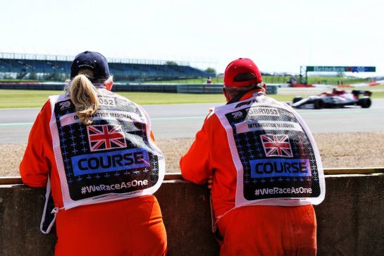 Marshals watch Kimi Raikkonen (FIN) Alfa Romeo Racing C39 in the first practice session.
31.07.2020. Formula 1 World Championship, Rd 4, British Grand Prix, Silverstone, England, Practice Day.
- www.xpbimages.com, EMail: requests@xpbimages.com © Copyright: Batchelor / XPB Images