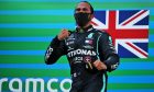 Race winner Lewis Hamilton (GBR) Mercedes AMG F1 celebrates on the podium.