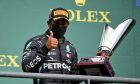 Race winner Lewis Hamilton (GBR) Mercedes AMG F1 celebrates on the podium.
