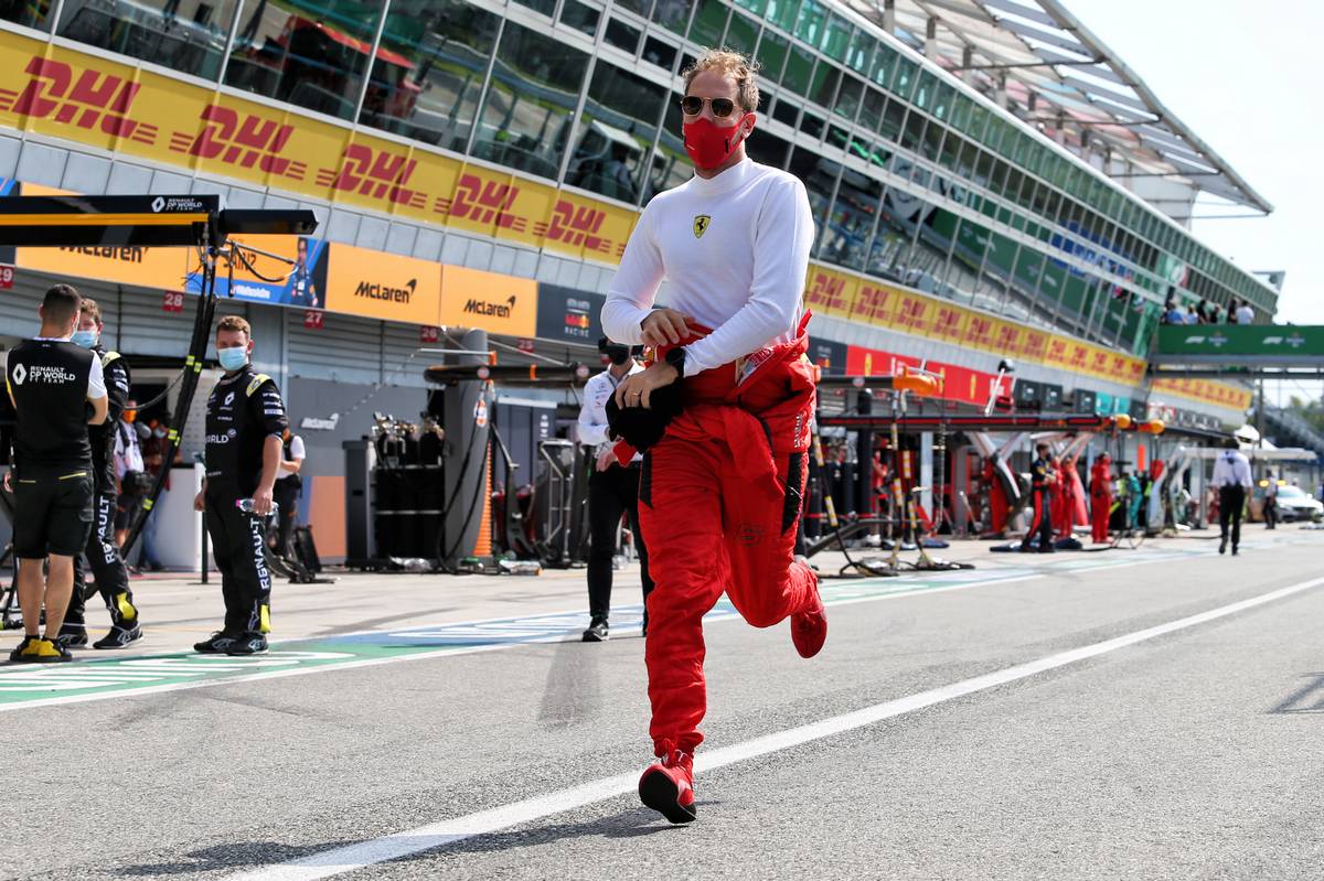 Sebastian Vettel (GER) Ferrari on the grid.