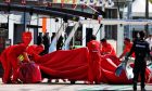 The Ferrari SF1000 of race retiree Charles Leclerc (MON) Ferrari is recovered back to the pits and an engine cover for Valtteri Bottas (FIN) Mercedes AMG F1 is brought out.