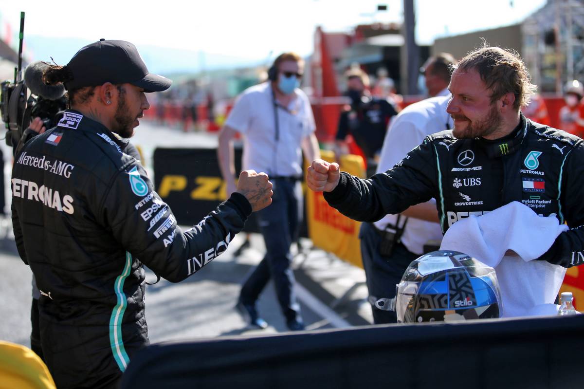 (L to R): Lewis Hamilton (GBR) Mercedes AMG F1 celebrates his pole position in qualifying parc ferme with second placed team mate Valtteri Bottas (FIN) 