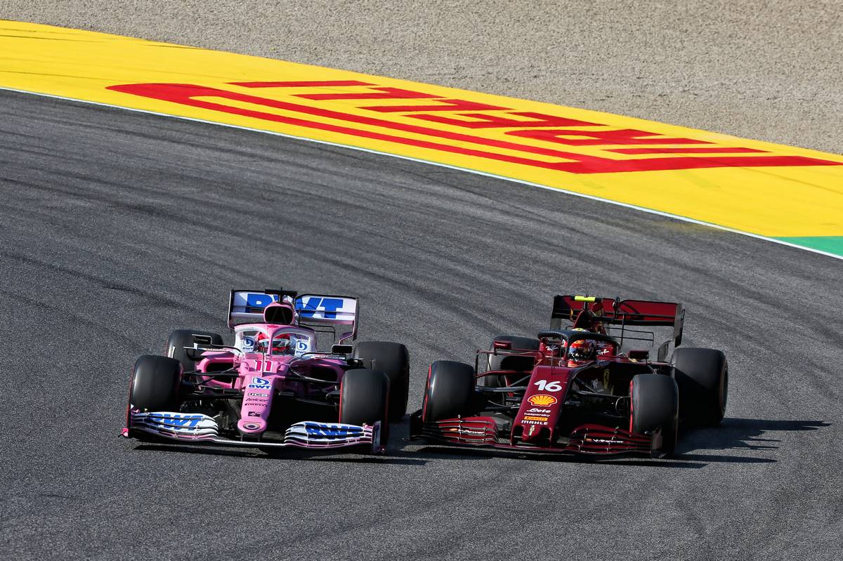 Sergio Perez (MEX) Racing Point F1 Team RP19 and Charles Leclerc (MON) Ferrari SF1000 battle for position.