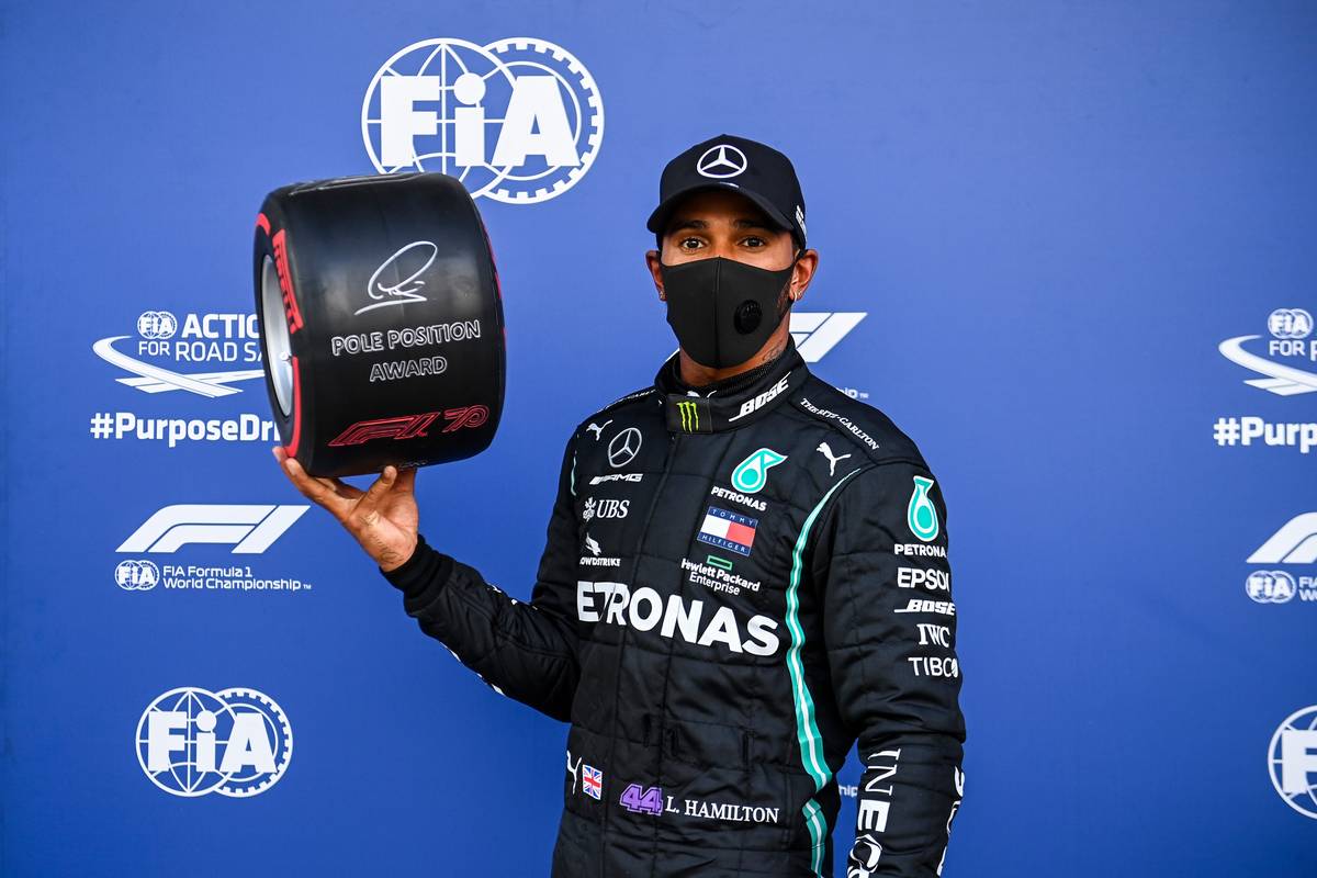 Lewis Hamilton (GBR) Mercedes AMG F1 celebrates with the Pirelli Pole Position Award in qualifying parc ferme.