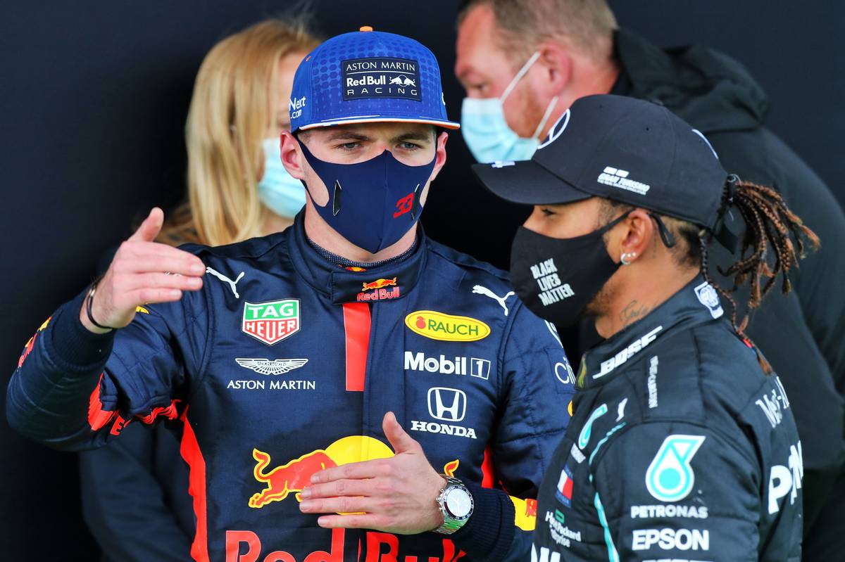 Max Verstappen (NLD) Red Bull Racing with Lewis Hamilton (GBR) Mercedes AMG F1 in parc ferme.