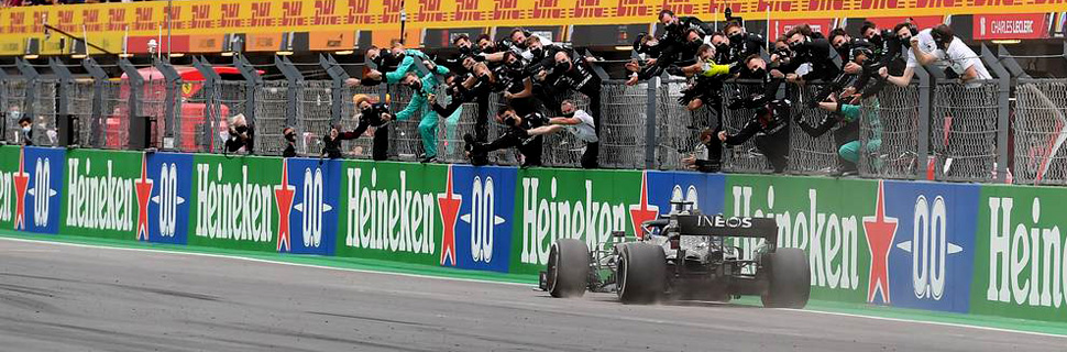 Race winner Lewis Hamilton (GBR) Mercedes AMG F1 W11 celebrates at the end of the race as he passes the team