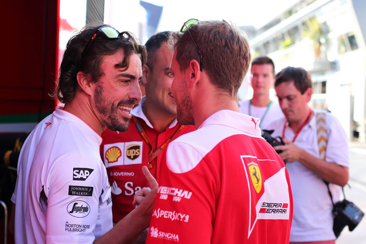 Fernando Alonso (ESP), McLaren Honda and Sebastian Vettel (GER), Scuderia Ferrari 