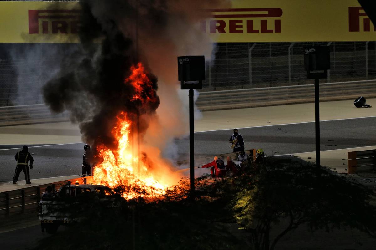 Marshals put out the fire of after Romain Grosjean (FRA) Haas F1 Team VF-20 crashed at the start of the race and exploded into flames. 29.11.2020. Formula 1 World Championship, Rd 15, Bahrain Grand Prix