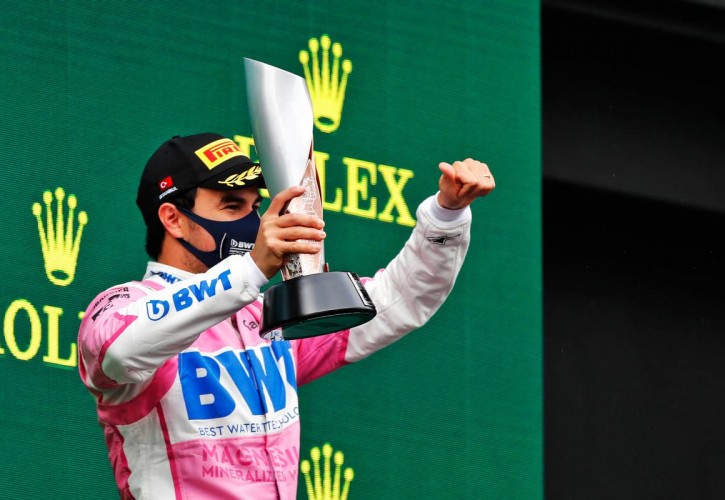 Sergio Perez (MEX) Racing Point F1 Team celebrates his second position on the podium.