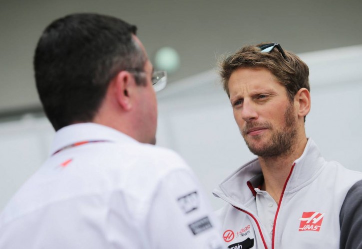 Eric Boullier (FRA) McLaren Racing Director with Romain Grosjean (FRA) Haas F1 Team.