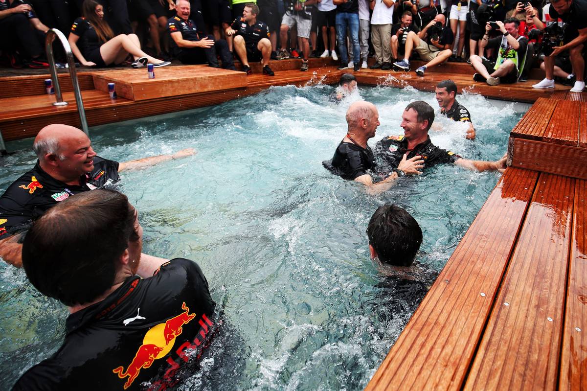 Christian Horner (GBR) Red Bull Racing Team Principal and Adrian Newey (GBR) Red Bull Racing Chief Technical Officer celebrate on the Red Bull Energy Station.