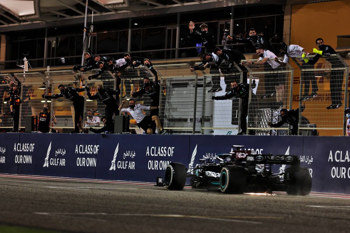 Race winner Lewis Hamilton (GBR) Mercedes AMG F1 W12 passes his celebrating team at the end of the race. 28.03.2021. Formula 1 World Championship, Rd 1, Bahrain Grand Prix