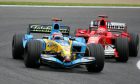 Fernando Alonso (ESP), Mild Seven Renault F1 R25 (front) and Michael Schumacher (GER), Scuderia Ferrari Marlboro F2005 (rear), fighiting for the lead of the race - April, Formula 1 World Championship, Rd 4, San Marino Grand Prix