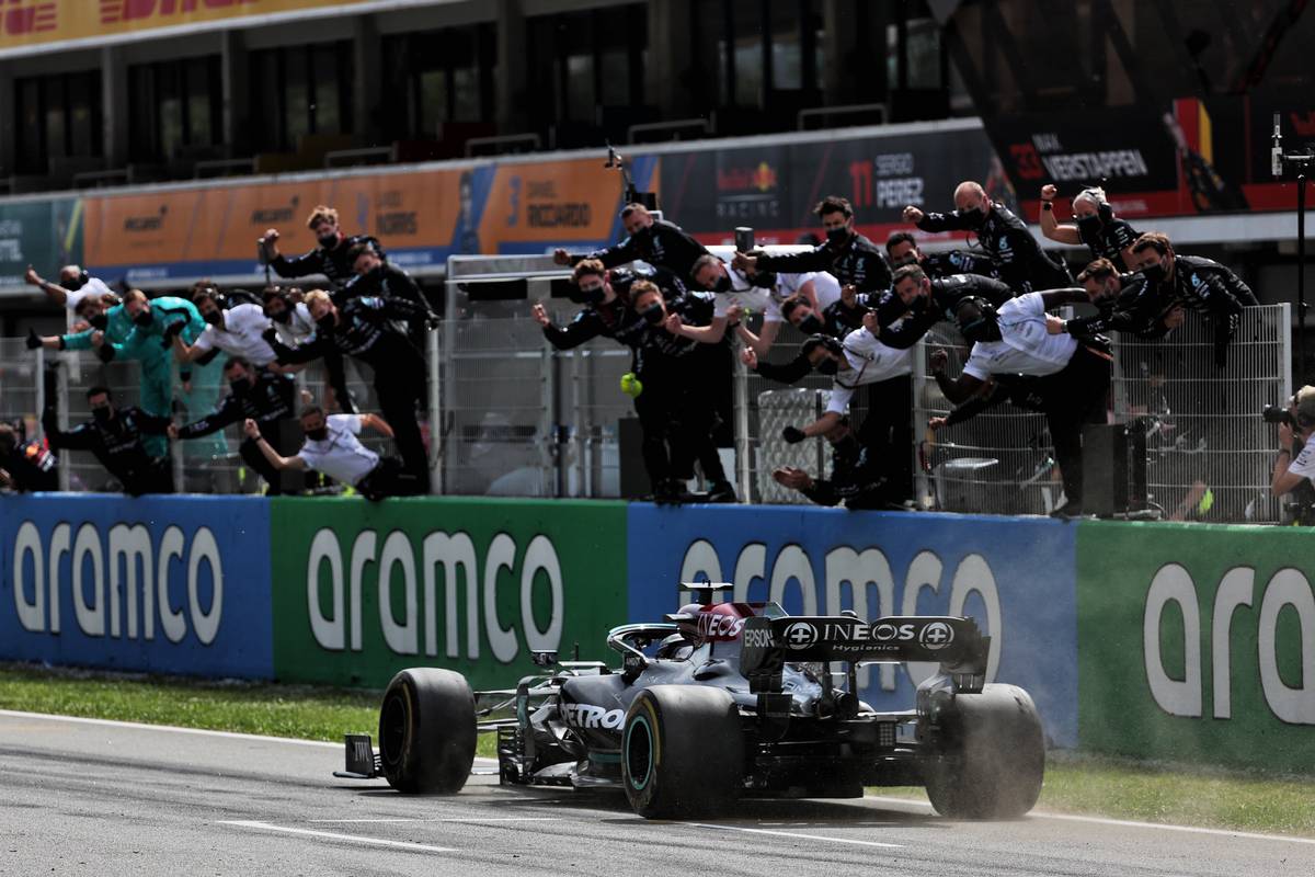 Race winner Lewis Hamilton (GBR) Mercedes AMG F1 W12 passes his celebrating team at the end of the race. 09.05.2021. Formula 1 World Championship, Rd 4, Spanish Grand Prix, Barcelona