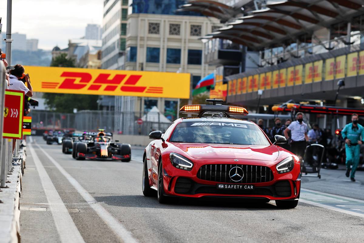 Sergio Perez (MEX) Red Bull Racing RB16B comes into the pits behind the Mercedes FIA Safety Car while the race is stopped. 06.06.2021. Formula 1 World Championship, Rd 6, Azerbaijan Grand Prix, Baku